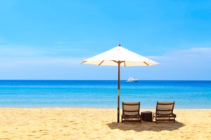 beds and umbrella on a beach